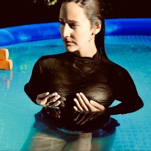 Black Long-sleeve see-through Mesh Top. NWT.